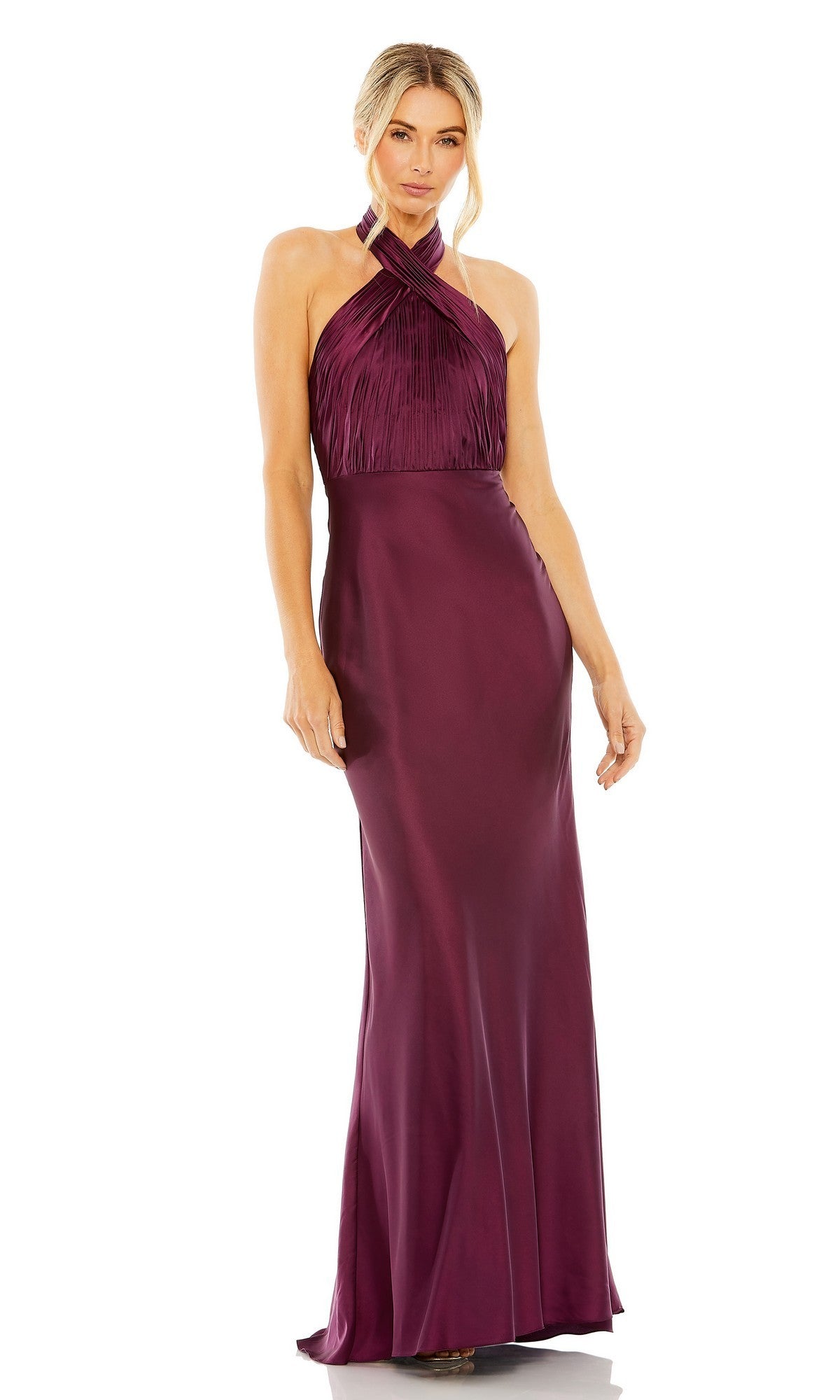 A woman wearing the Mac Duggal 55995 long formal dress in plum, featuring a sleeveless halter neckline, a fitted bodice, and a smooth satin floor-length skirt, poses against a plain white background.